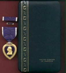 US Purple Heart medal in case with ribbon bar and lapel pin