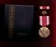 US Meritorious Service medal in case with ribbon bar and lapel pin